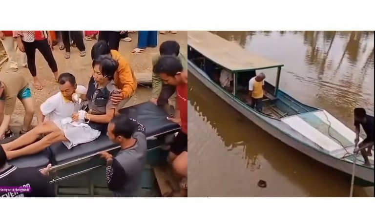 Seorang pasien dinaikkan perahu untuk dirujuk ke Kota Kendari